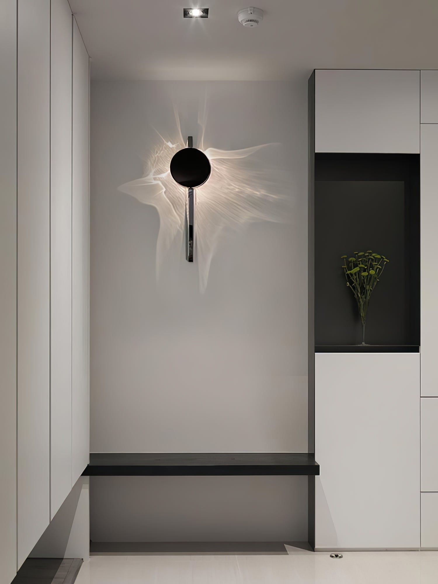 Kinetisk vägglampeskulptur med skuggprojektion i krom – Lamylie